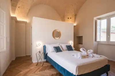 Image de Chambre 'Relais Luxury Xenia - Ulivo' avec piscine partagée, Wi-Fi et climatisation