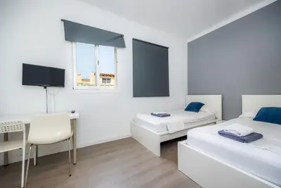 Image de Chambre Deux lits individuels Nº5' avec terrasse partagée, Wi-Fi et climatisation