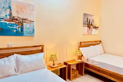 Image de Comfy 2-bedroom apartment with WiFi, Ac in vibrant area in Dar es Salaam🥰