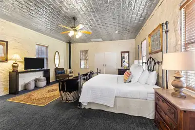 Room with One King Bed, microwave, mini-fridge, and porch