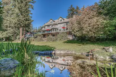 Family friendly water view escape with deck, games and garden views