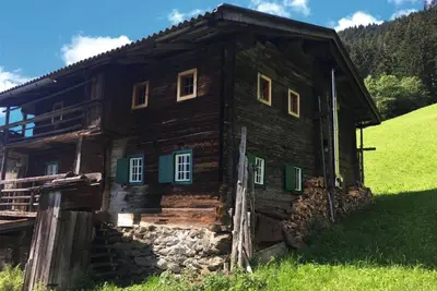 Image de Maison de vacances 'Goass'n Alm Zillertal' avec vue sur montagne, terrasse privée et jardin privé