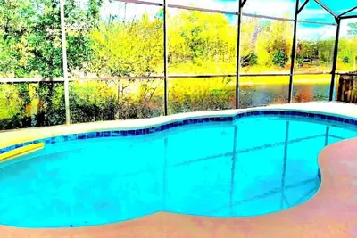 Image de Ref 994pf. Modern lake view pool home. Very close to Disney