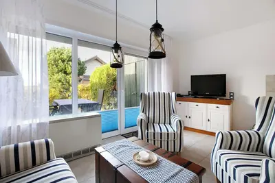 Image de Maison de vacances 'Kajüte Am Norderhafen' avec terrasse privée et jardin privé