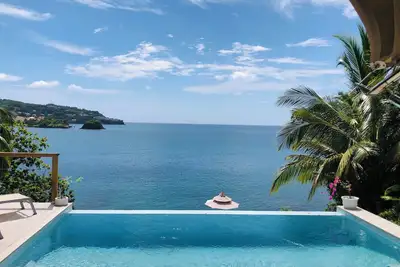 Image de A Waterfront Luxury Tented Experience, with a Saltwater Infinity Pool and Beach.