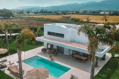 Image de Thrilling Kos Villa | Villa James-Sirius | 3 Bedrooms | Spacious Furnished Sun Terrace | Private Outdoor Pool | Bbq Facilities | Shaded Outdoor Dining Area | Tesla Car Included | Shared Outdoor Gym, Playground, Cinema and Bar | Tigaki