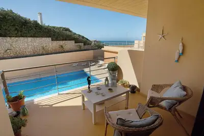 Image de Appartement 'Praia Areia Branca' avec vue sur la mer, piscine partagée et Wi-Fi