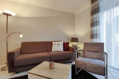 Image de Modern vacation apartment 2 in Haus Zyrus with beach chair on the beach in Duhnen