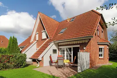 Image de Maison de vacances 'Ferienhaus Lisa Hooksiel' avec terrasse privée, jardin privé et Wi-Fi