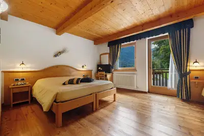 Image de Chambre 'Camera Quadrupla N 1' avec vue sur les montagnes, jardin partagé et Wi-Fi