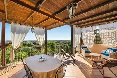 Image de Maison de vacances 'Villino Iris 8 Is Molas Golf Resort' avec vue sur la mer, terrasse et Wi-Fi