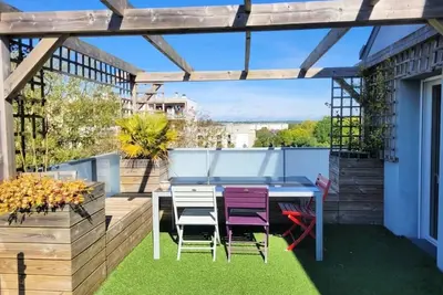 Image de Le Nid : Rooftop moderne surplombant la ville