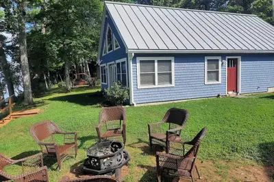 Enjoy amazing sunsets while steps from North Pond in this cozy 3-bedroom camp.