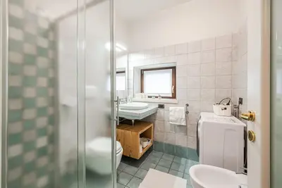 Image de Giardino di Romeo, appartamento a pochi passi dal Teatro Romano e Ponte Pietra.