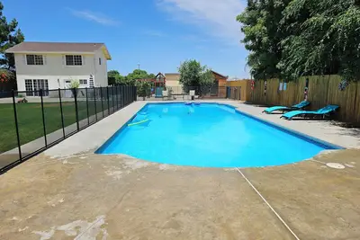 Image de Spacious 2 story gated home w/ pool & play area.