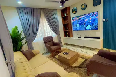 Image de A four bedroom smart  Gated Apartment, Wi-fi, Cctv short drive from the Airport