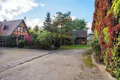 Image de Maison de vacances 'Blockbohlen-Haus Auf Hof Verchen' avec terrasse privée, jardin privé et Wi-Fi