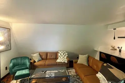 Image de This modern A-Frame home promises a sanctuary of comfort and tranquility.