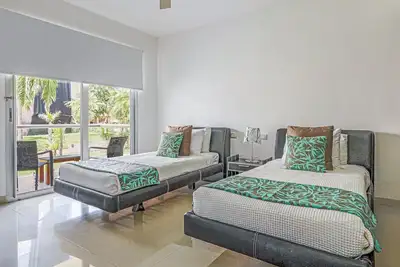 Luxury studio with pool access, modern amenities, and steps to vibrant beach