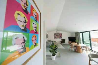 Image de Les Suites du Parc : Appartement d'exception au dernier étage avec une grande terrasse vue mer de 2 chambres face au parc Simone Veil à 2 minutes des halles