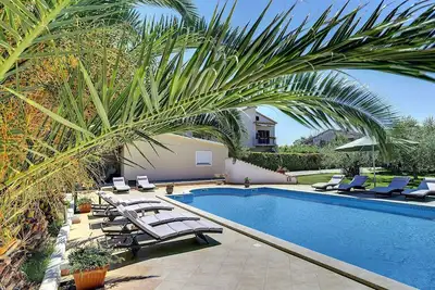 Image de Appartement avec piscine, air conditionné - à la plage de sable 700 mètres