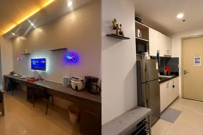 Image de Comfortable staycation condo in the heart of Makati with resort style pools.