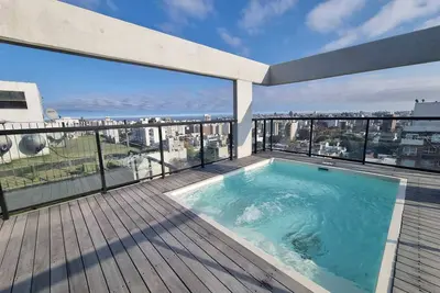 Image de A modern loft with a smart key system, located close to a Mall and beaches.