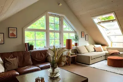 Image de Charming attic apartment by the sea - with fireplace and cozy living room