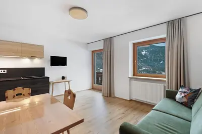 Image de Appartement 'Pfaffingerhof Dolce Wood' avec vue sur les montagnes, jardin partagé et Wi-Fi