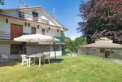 Image de Appartement 'Immerso Nel Verde' avec vue sur montagne et jardin privé