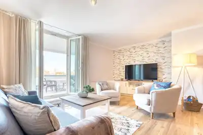 Image de 5-star vacation apartment Strandläufer near the Baltic Sea, with large living room