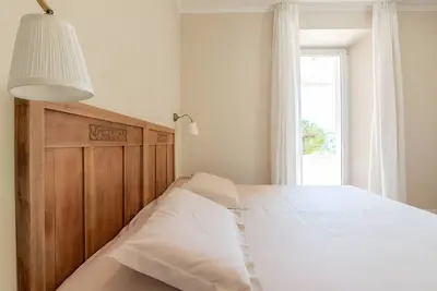 Image de Appartement 'Camera Matrimoniale Vista Giardino' avec vue sur les montagnes, piscine et Wi-Fi