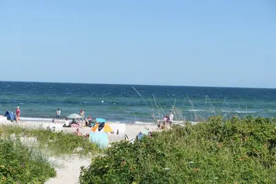Image de Appartement 'Godewind App D5 Am Ostseestrand' avec vue sur la mer, terrasse privée et Wi-Fi