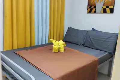 Image de Cozy 1-bedroom condo with Ac, WiFi in lovely Quezon City