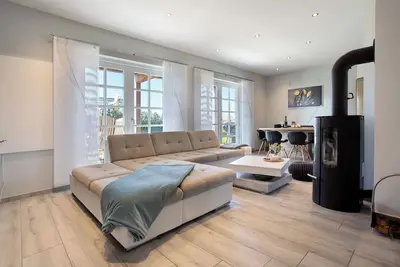 Image de Appartement 'Komfortables Ferienhaus Hafen' avec terrasse privée, jardin privé et Wi-Fi
