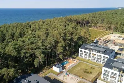 Image de Appartement en bord de mer, piscine d'été