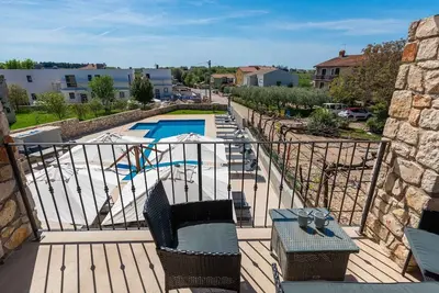 Image de Appartement de vacances avec climatisation et piscine commune