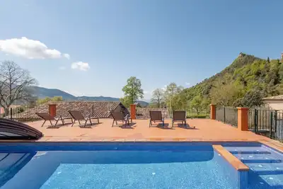 Image de Maison de campagne 'Cal Nan' avec vue sur la montagne, piscine partagée et Wi-Fi