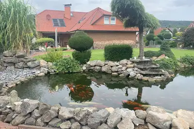 Image de Wesergarten vacation home with fireplace, large garden and well-kept fish pond