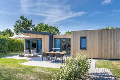 Image de Bienvenue au Muralt 110, un chalet moderne avec tout pour un séjour sans soucis. Profitez du salon c