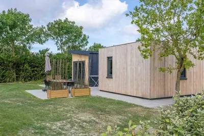 Image de Bienvenue au Muralt 111, un chalet moderne avec tout pour un séjour sans soucis. Profitez du salon c