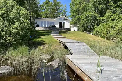 Image de Newly built cottage located on a lake plot by Lake Flaten | Se05035