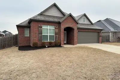 Image de Charming 3-bedroom house conveniently located in Rogers.