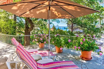 Image de Charmant appartement à seulement 200 mètres de la plage avec vue sur la mer, chaises longues, espace barbecue