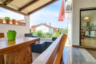 Image de Appartement pittoresque à seulement 800 mètres de la plage avec terrasse privée, barbecue, WiFi
