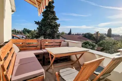 Image de Appartement moderne à seulement 250 mètres de la plage avec 2 balcons, machine à laver, WiFi