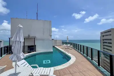 Image de Apartamento confortável c piscina a 100m da praia