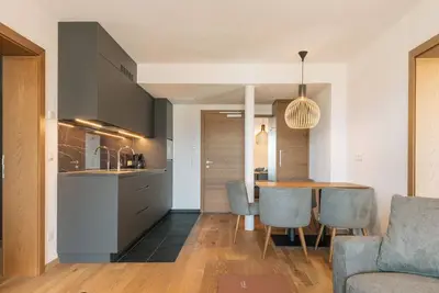 Apartment with large south-facing terrace, incl. garage parking space