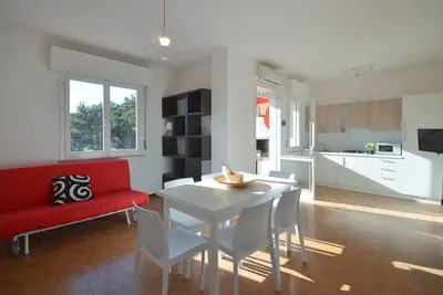 Image de Appartement moderne avec piscine partagée à Bibione