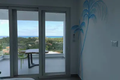 Image de 2 rooms and 1 bathroom in shared luxury Villa. Seaview infinity pool - Hammocks.